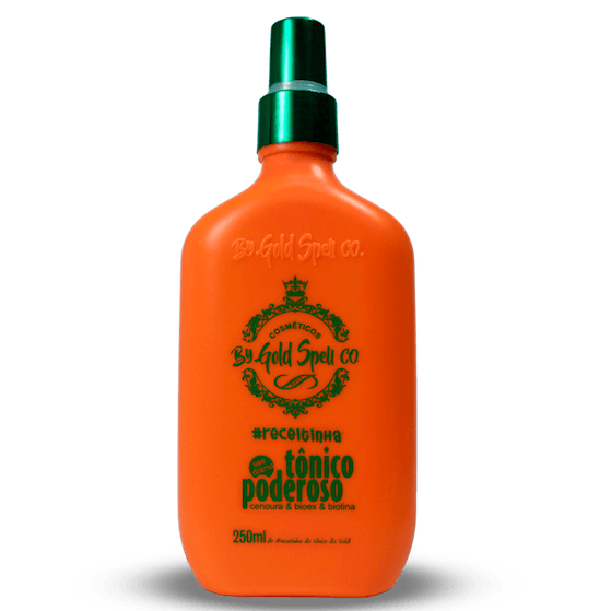 A bottle of By Gold Spell Tonico Poderoso hair loss treatment with a bright orange label and green cap, containing 250ml of the solution.