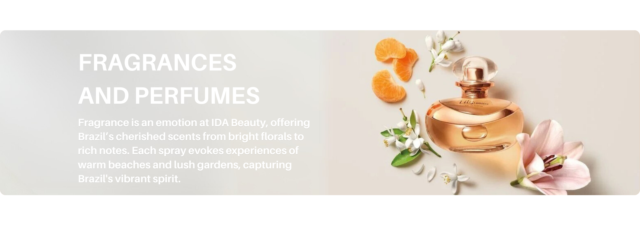 Perfume bottle surrounded by orange slices and delicate flowers, representing IDA Beauty’s Fragrances & Perfumes collection.