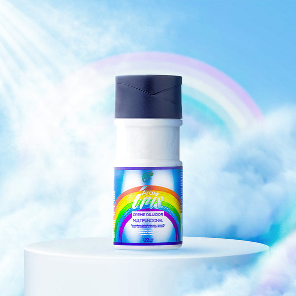 A bottle of Rainbow Thinner Multifunctional Cream with a colorful label featuring a rainbow, displayed on a pedestal with a bright blue and rainbow background.